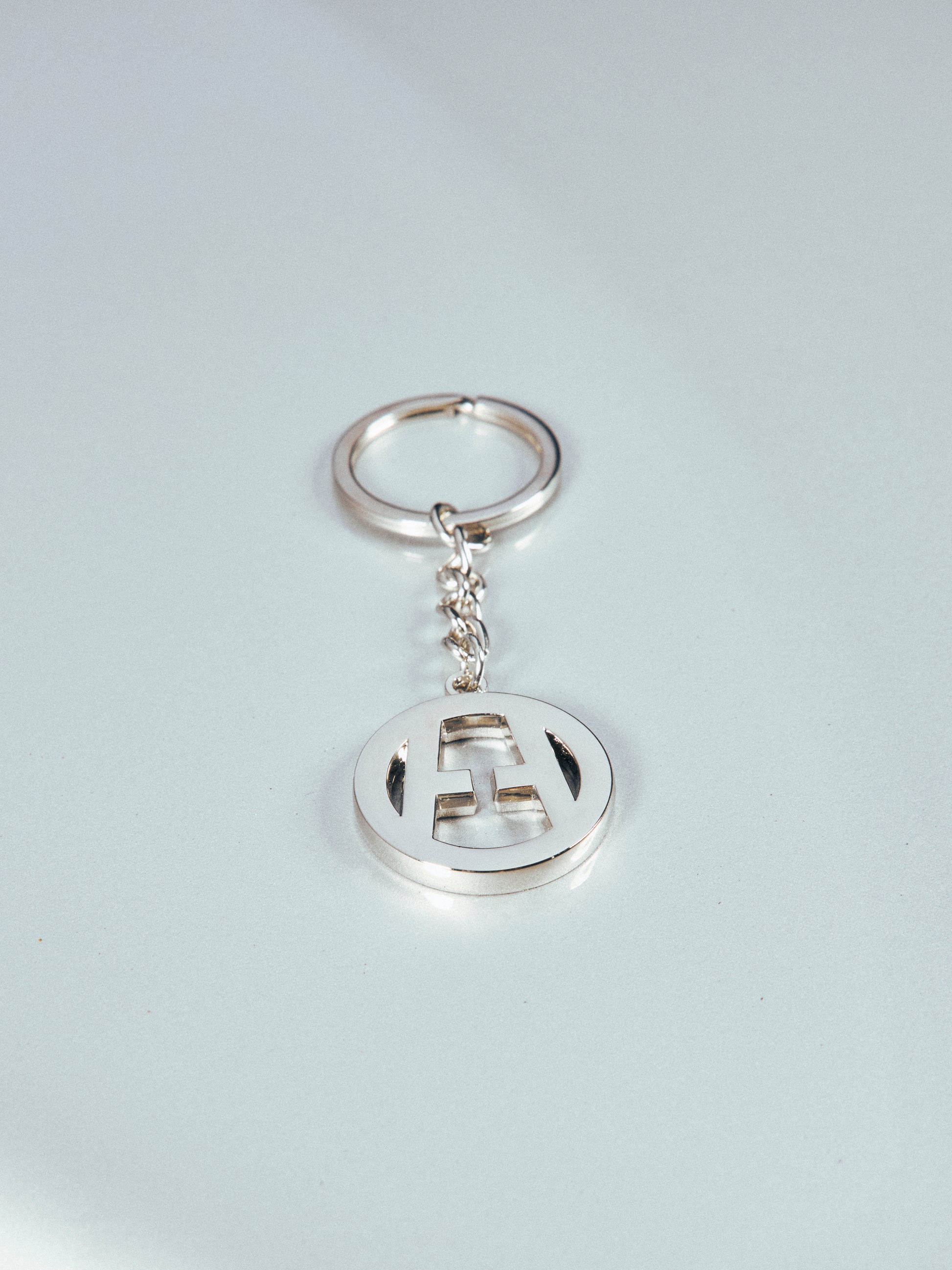 H CIRCLE LOGO KEYRING